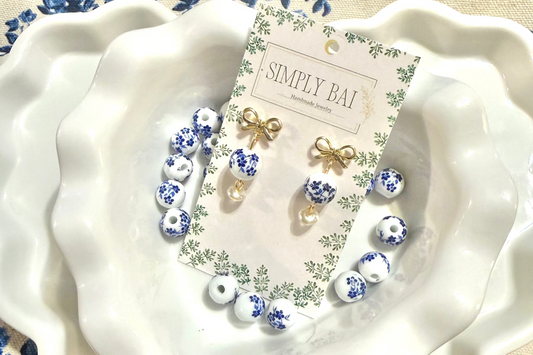 The Daphne | Blue and white floral bead Earrings with gold bow accent