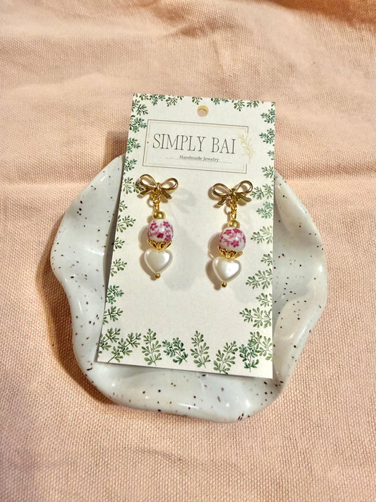 Rosalie | soft romantic pink and white bead earrings with pearl heart and gold bow details